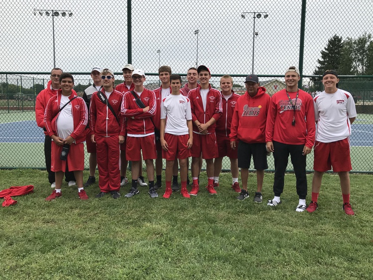 The Coldwater Boys Tennis Team posing in fron of tennis courts after playing at   the Vicksburg invitational